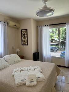 a bedroom with a bed with towels on it at Carilo Princess in Carilo +60 photos