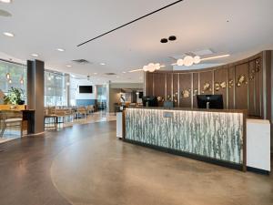 a lobby of a hotel with a reception desk at Hotel Indigo Asheville Downtown by IHG in Asheville