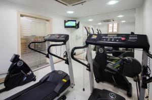 a gym with two tread machines in a room at Hotel Monte Alegre in Rio de Janeiro