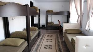 Postel nebo postele na pokoji v ubytování Apple Hostel Bishkek