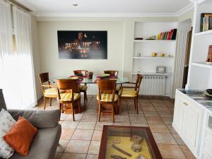 a living room with a table and chairs at Los Marqueses de Teruel - VUT EL Amor del Marqués in Teruel