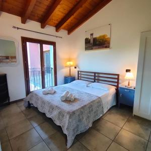Postel nebo postele na pokoji v ubytování Agriturismo borgo del mincio