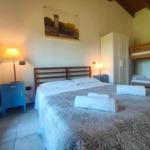 Postel nebo postele na pokoji v ubytování Agriturismo borgo del mincio