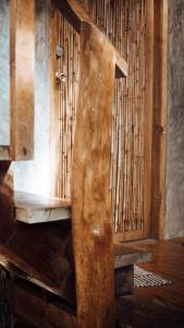 a close up of a wooden door in a room at Red Gumamela House in San Isidro