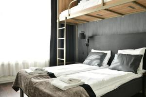 Postel nebo postele na pokoji v ubytování K7 Hotel Oslo