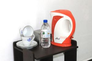 a toaster and a bottle of water on a table at Royal Breeze Resort Sigiriya in Sigiriya