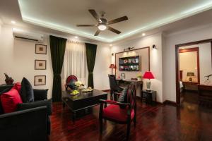 a living room with a couch and a dining room at Bonjour D' An Nam Home in Hanoi +52 photos