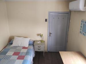 Postel nebo postele na pokoji v ubytování Ñuñoa Vive 1
