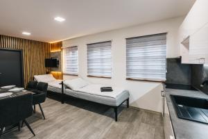 Katil atau katil-katil dalam bilik di Apartmány U Doskočilů
