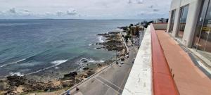 a view of the ocean from a building at COBAR0108 - Edifício Oceania in Salvador +37 photos