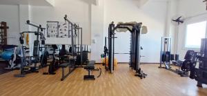 a gym with a bunch of tread machines in a room at COBAR0108 - Edifício Oceania in Salvador