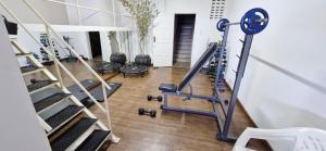 a gym with treadmills and a row of treadleys at COBAR0108 - Edifício Oceania in Salvador