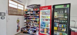 two soda machines in a store with drinks at COBAR0108 - Edifício Oceania in Salvador