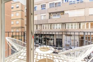 a view of a building from a balcony at Casa Woopi Torrevieja in Torrevieja