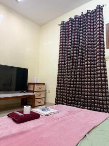 TV o dispositivi per l'intrattenimento presso BlessyWail Homestay