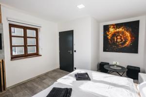 Katil atau katil-katil dalam bilik di Apartmány U Doskočilů
