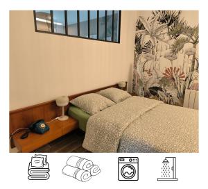 a bedroom with two beds and a window at L'entre-deux in Périgueux