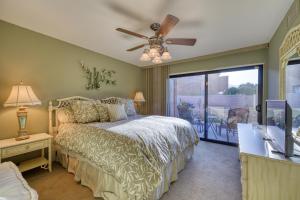 a bedroom with a bed and a ceiling fan at Villas de Las Flores Serena in Palm Springs