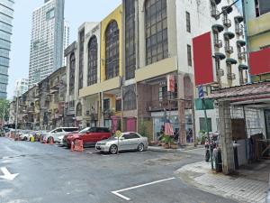 a city street with cars parked in front of buildings at Super OYO 90780 J Hotel Bukit Bintang in Kuala Lumpur +31 photos