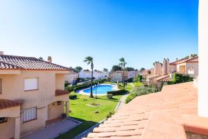 a view from the balcony of a house with a swimming pool at Rentalmar Brisas in Miami Platja