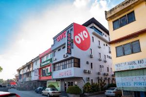 a building with a stop sign on the side of it at Skudai Hotel in Skudai