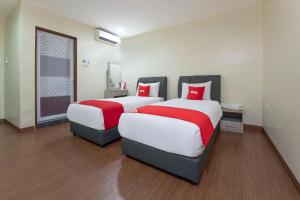 Postel nebo postele na pokoji v ubytování OYO 90380 Hotel Jasin