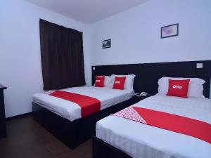 Postel nebo postele na pokoji v ubytování Super OYO 43959 Astana Hotel + 32 fotografií