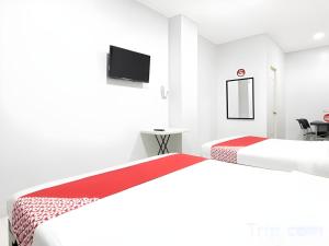 Postel nebo postele na pokoji v ubytování OYO 152 Sangco Condotel
