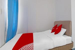 Postel nebo postele na pokoji v ubytování Loveness Apartelle