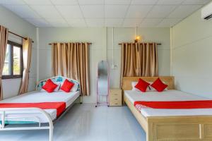 Postel nebo postele na pokoji v ubytování Linh Dan Bungalow
