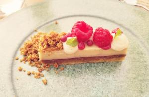 a piece of cake with raspberries on a plate at Room No stress on Cres in Cres