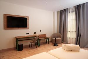 A bed or beds in a room at Sercotel Princesa De Eboli