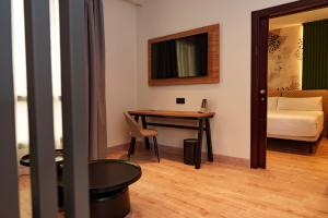 A bed or beds in a room at Sercotel Princesa De Eboli
