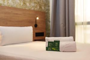 A bed or beds in a room at Sercotel Princesa De Eboli