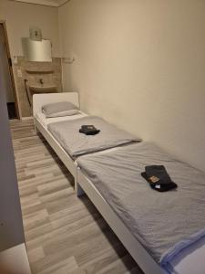 Postel nebo postele na pokoji v ubytování Hotel Garni Krone