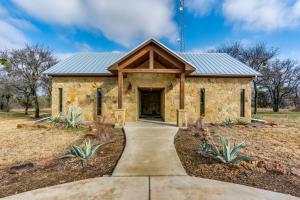 a stone building with a pathway in front at Sundance Club Resort in Gordon