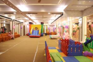 a large room with a play room with a play floor at Hotel Liyan Inn in Kānpur