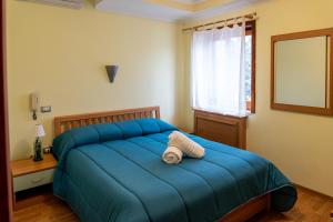 Postel nebo postele na pokoji v ubytování Avernum Relais Hotel e Ristorante