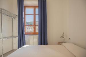 Ένα ή περισσότερα κρεβάτια σε δωμάτιο στο Ponticello Mare - HelloElba