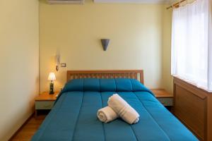 Postel nebo postele na pokoji v ubytování Avernum Relais Hotel e Ristorante