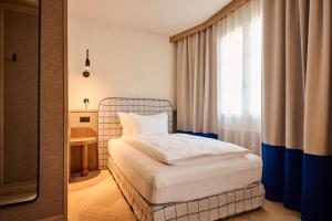 Postel nebo postele na pokoji v ubytování Sorell Hotel Speer