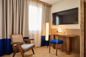 TV a/nebo společenská místnost v ubytování Sorell Hotel Speer