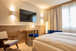 Postel nebo postele na pokoji v ubytování Sorell Hotel Speer