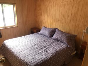 Postel nebo postele na pokoji v ubytování Hostal Huepil