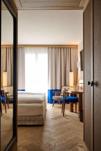 Postel nebo postele na pokoji v ubytování Sorell Hotel Speer