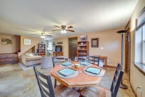 a dining room and living room with a table and chairs at Hunt, Fish and Enjoy the Outdoors Rural Atoka Home in Atoka