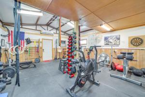 a gym with several bikes and weights in a room at Hunt, Fish and Enjoy the Outdoors Rural Atoka Home in Atoka