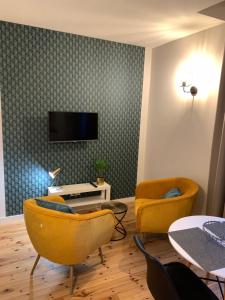 TV a/nebo společenská místnost v ubytování Résidence Plaisance