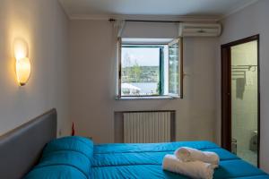 Postel nebo postele na pokoji v ubytování Avernum Relais Hotel e Ristorante