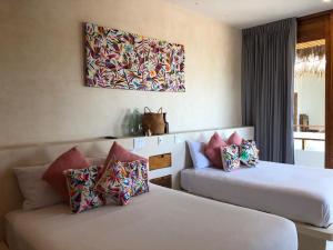 Postel nebo postele na pokoji v ubytování Hotel Casa Margot